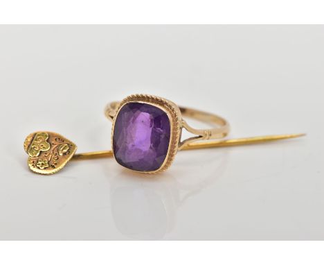 A 9CT GOLD AMETHYST RING AND A STICK PIN, the ring designed with a cushion cut amethyst, collet mount with a rope twist surro