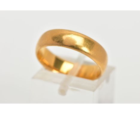 A 22CT GOLD BAND RING, a soft courted band ring approximate width 5mm, approximate depth 1.5mm, ring size N leading edge, hal