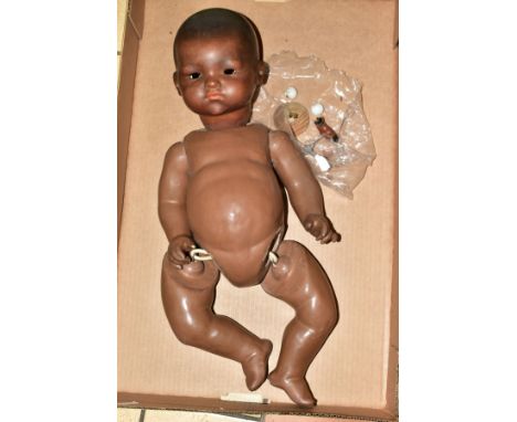 AN ARMAND MARSEILLE BLACK DREAM BABY DOLL bisque head with closed mouth, marked AM 341/8K, composite body and limbs, height a