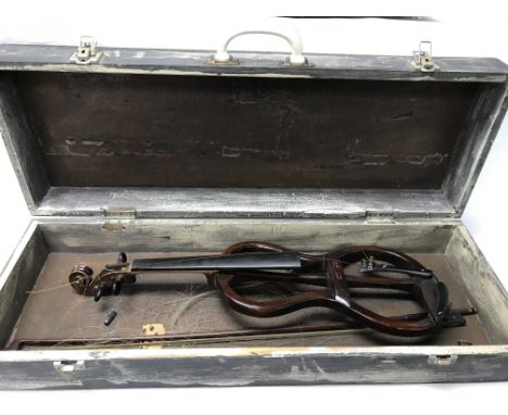 An unusual open frame vintage practise violin with two bows in a wooden box.