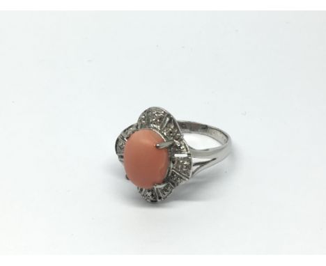 A 14ct white gold coral and diamond cluster ring