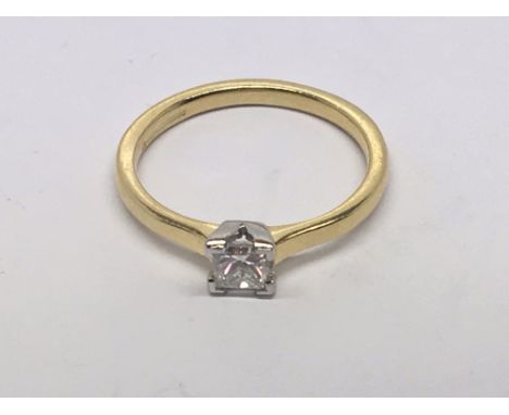 An 18 carat gold solitaire diamond ring the brilliant cut diamond 0.35 carat. Ring size M.