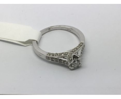 A modern style white gold diamond ring approx .35pts, approx 2.7g and approx size M-N.