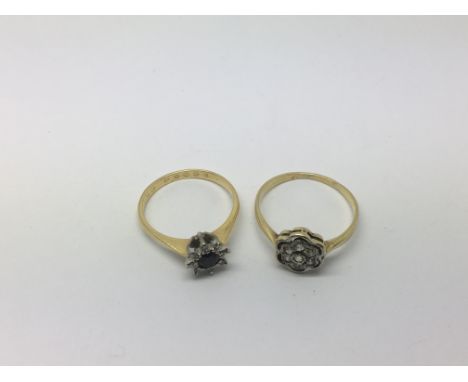 Two gold rings set with stones, approx 4.5g and approx sizes M and O.