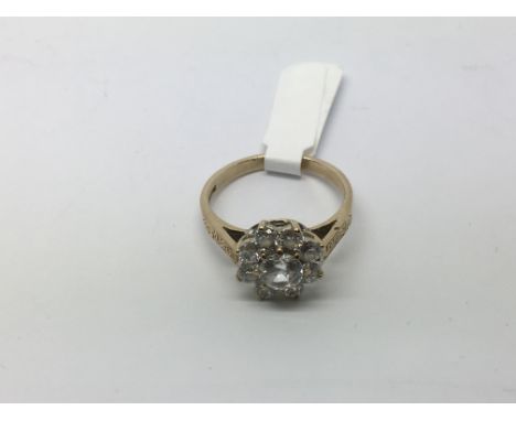 A 9ct gold stone set cluster ring, approx 3.9g and approx size Q-R.