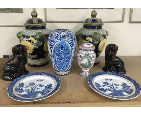 A large pair of decorative sunflower pottery vases, two faience vases, pair of dogs and plates