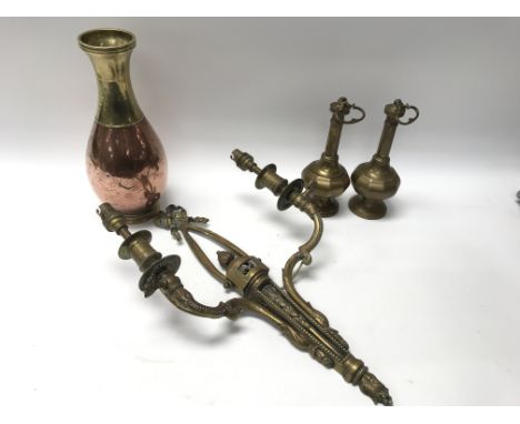 An oriental brass and copper vase engraved with flowers, a brass vintage wall sconce and a pair of unusual brass lidded vases