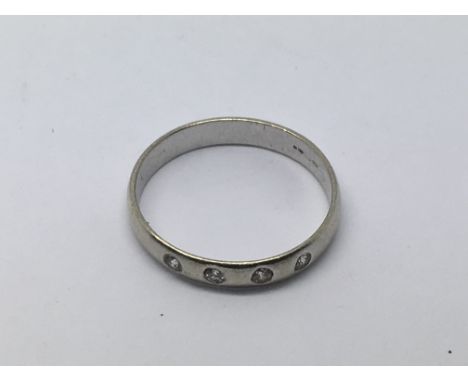 An 18ct white gold ring set with four small diamonds, approx 1.24g and approx size H-I.