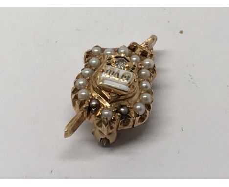 An American 14carat gold Masonic pin pendent decorated with seed pearl and small diamonds.