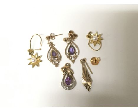 A pair of amethyst earrings with conforming pendant, a pair of gold and pearl earrings and a one other. Total weight approxim