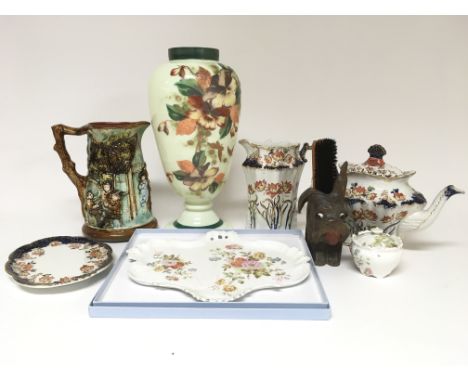 A small collection of ceramic oddments to include a jug, vase, teapo, and dressing table set, incomplete.