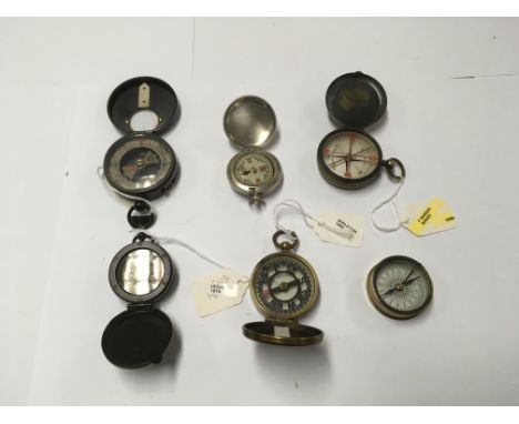 A collection of 6 compasses to include a Barker Uicus 1975 and a Negretti &amp; Zambra Barker made compass