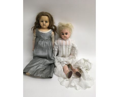 Two composite wax head dolls, both with cloth bodies, glass eyes and ceramic wooden limbs.Largest approx 47cm long to 44cm lo