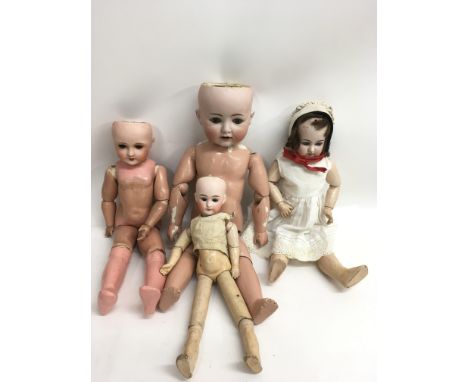 Four antique bisque headed dolls including a Goebel example, all with painted faces.Largest 53.5 to 37cm, all a/f