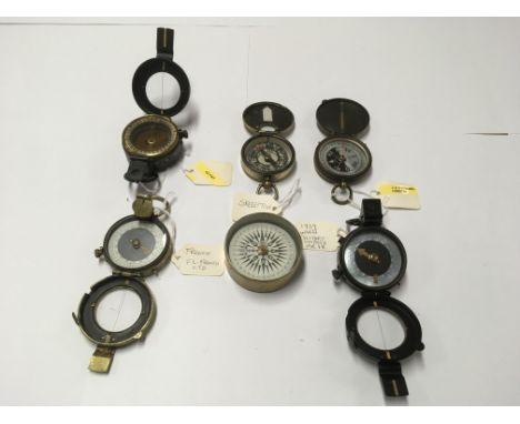 A collection of 6 compasses to include a Mk IX Barker compass, a Barker skeleton and others.