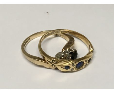 An 18ct gold ring set with blue sapphire and one other 9ct gold two stone crossover ring set with a diamond and sapphire.