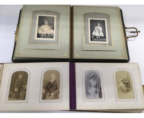 Two Victorian photo albums, one having a mother of pearl cover.