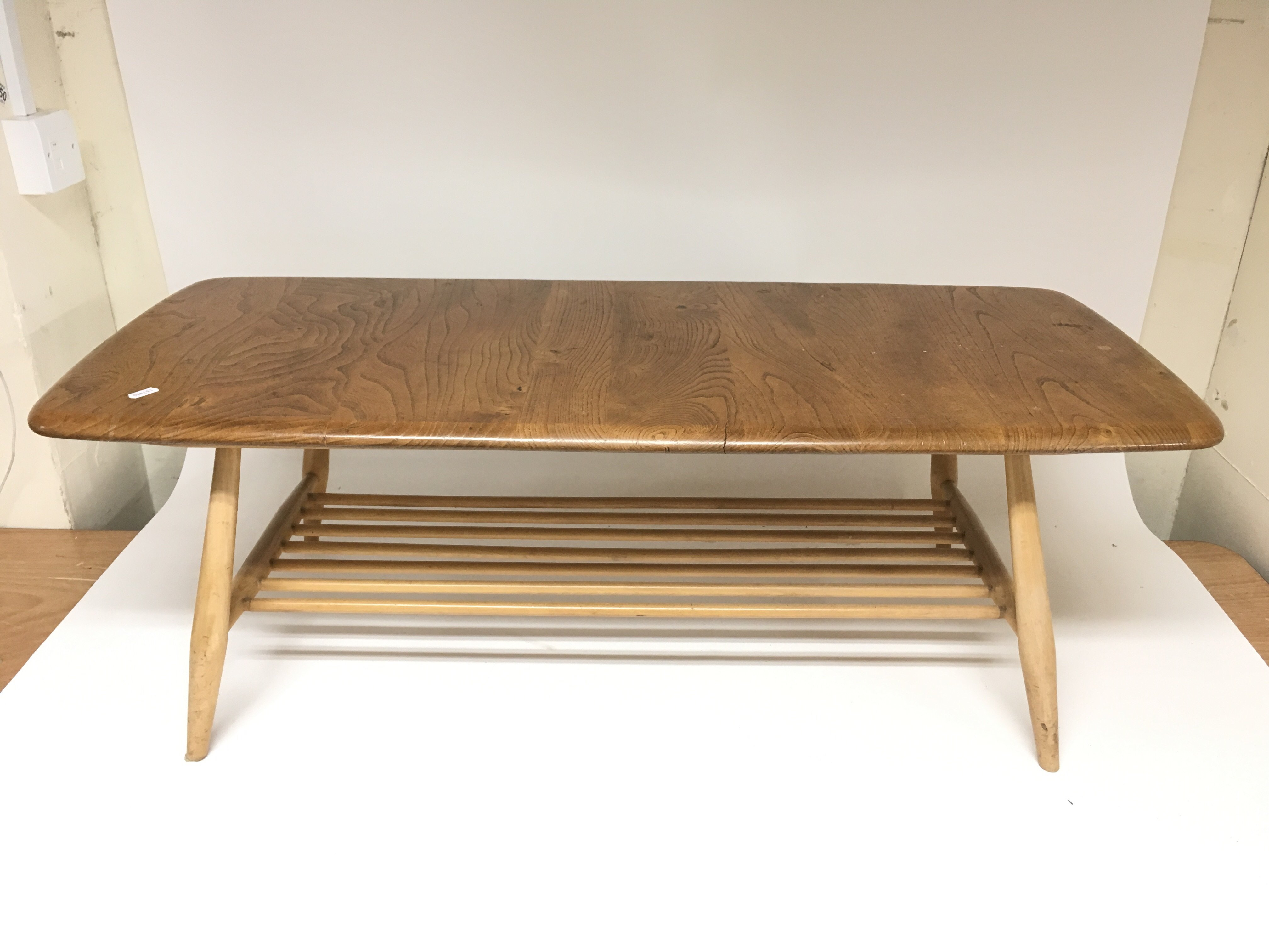 A modern Ercol coffee table, measures approx 106cm long x 46cm deep x