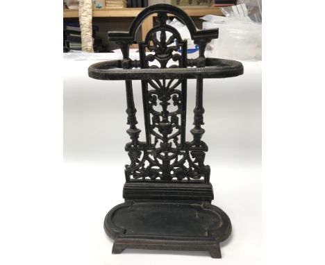 A small cast iron stick stand.