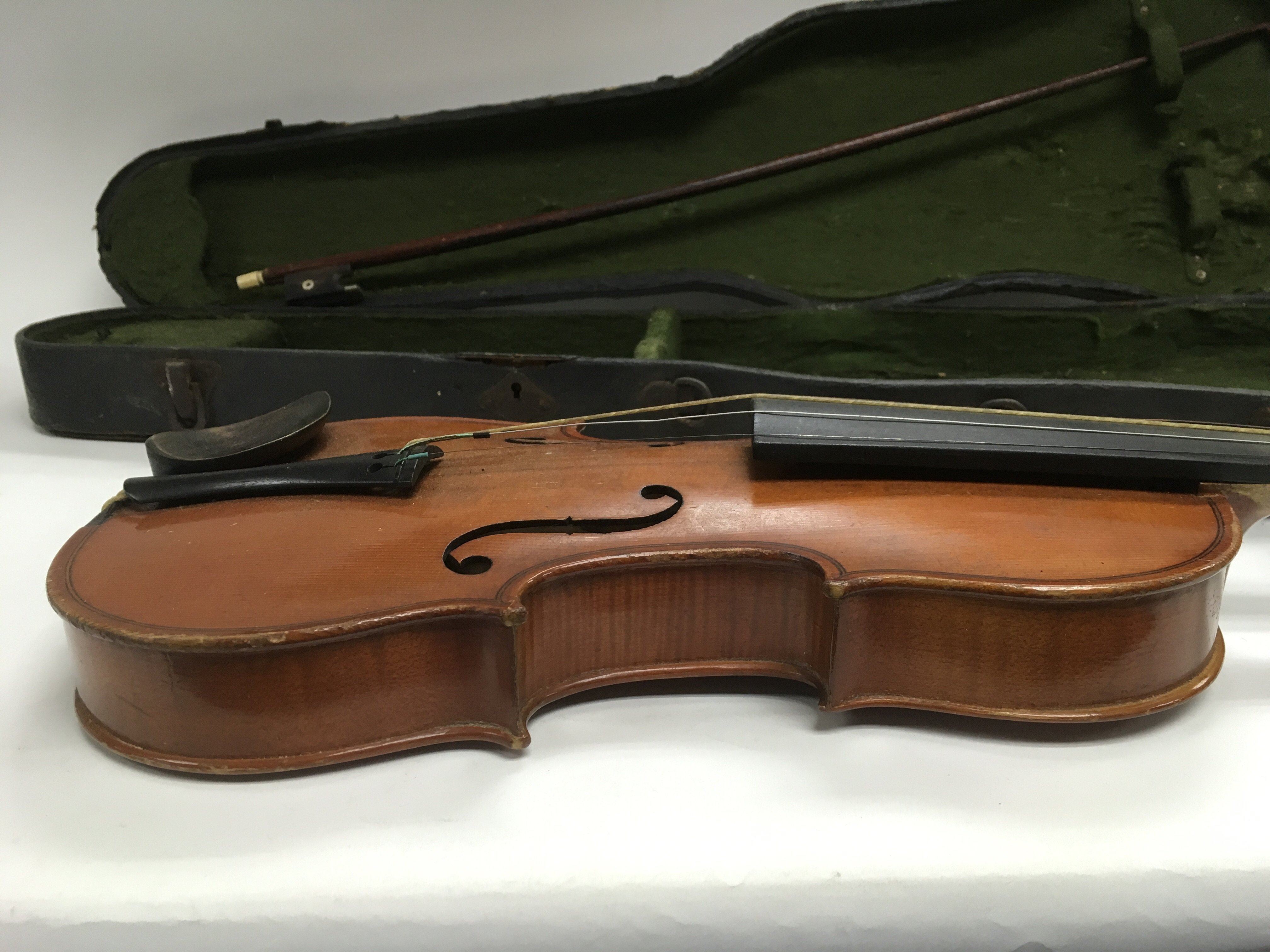 An antique violin with bow and case, label inside violin marked J