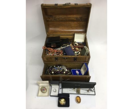 A wooden stud work casket chest containing vintage costume jewellery