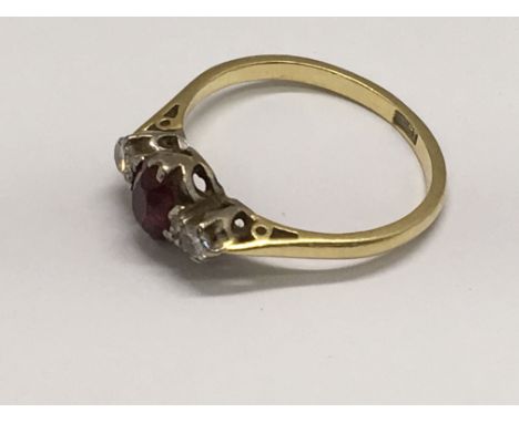 An 18ct gold ring set with a ruby, approx size N/O