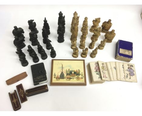 A 19th century set of Jaques caricature playing cards a Chinese carved wood chess set and other cards and gaming dice