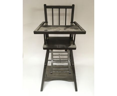 A vintage children’s high chair.