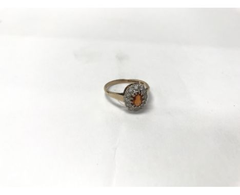 A 9ct gold ring with central amber stone. Weight approx 2.1g, size approx P