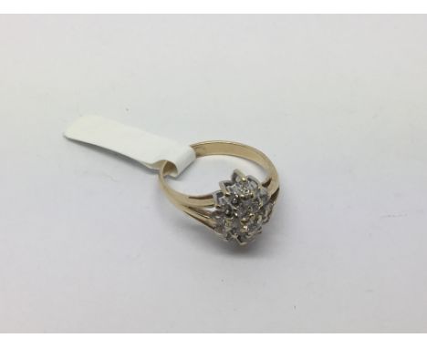 An unusual shaped diamond set cluster ring, approx 3.3g and approx size M.