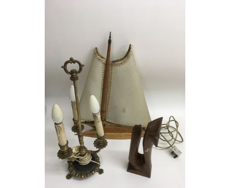 A boat shaped lamp, brass candelabra and modernist wooden sculpture