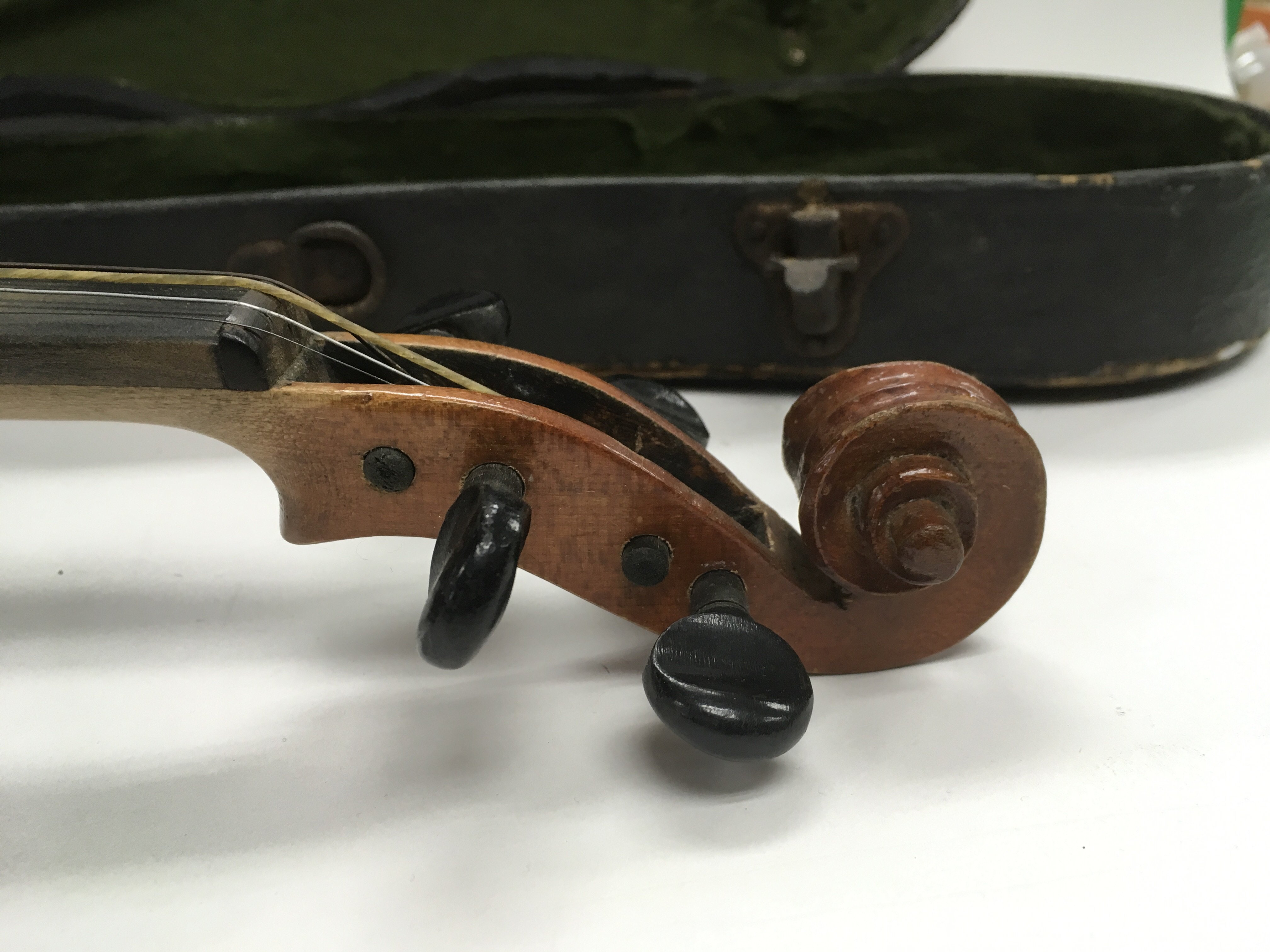 An antique violin with bow and case, label inside violin marked J