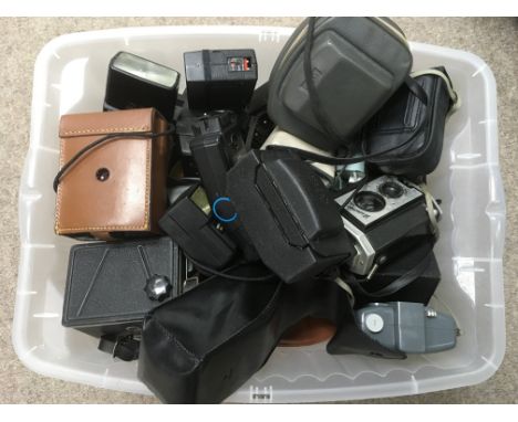 A box containing vintage cameras.