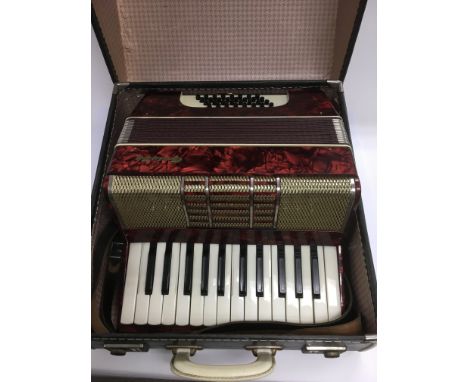 A cased Galotta accordion.