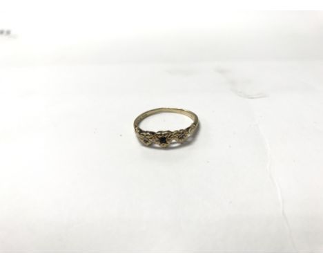 A 9ct gold ring with 3 heart shapes; the centre being encrusted with a sapphire. Weight approx 1.8g, size approx Q/R.