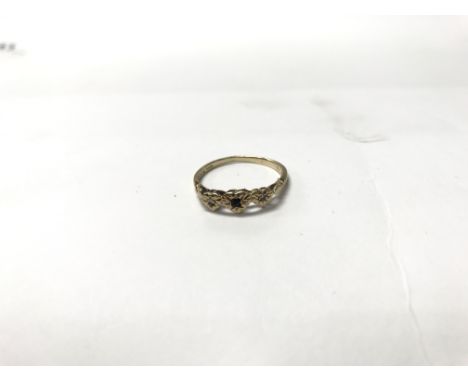 A 9ct gold ring with 3 heart shapes; the centre being encrusted with a sapphire. Weight approx 1.8g, size approx Q/R.