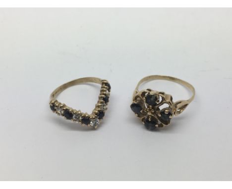 Two 9ct gold rings comprising a sapphire cluster ring, approx 2.8g and approx size O and a wishbone ring set with sapphires, 