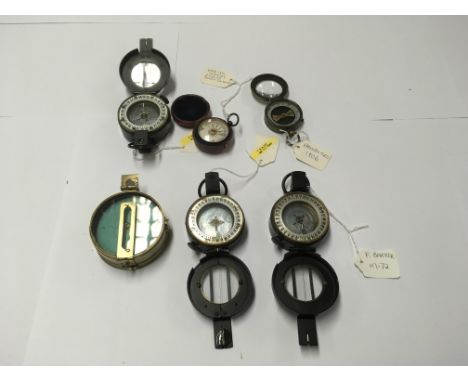 A collection of 5 compasses and a Barker damp detector, including a Barker M-72
