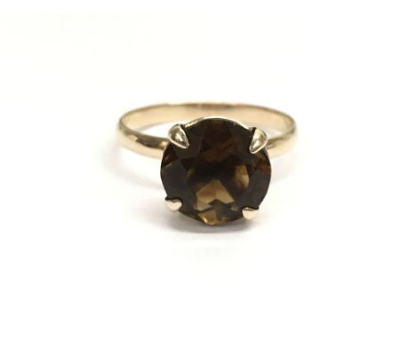 A ladies gold and citrine ring. Ring size approx N, weight approx 1.8 grams.