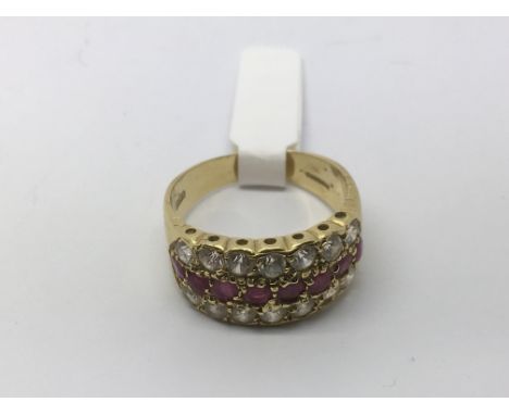 An 18ct gold half hoop ring set with rubies, approx 6.5g and approx size Q.