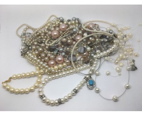 A collection of pearl necklace earrings, some cultured.