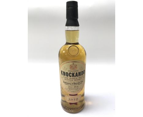 A vintage bottle of 'Knockando' Single Malt whiskey dated 1978 and bottled bottled in 1992 after 14 years. Excellent level.