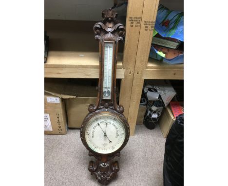 A carved mahogany barometer with mercury thermometer, approx 86cm.