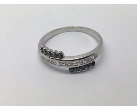 A white gold ring set with blue and white diamonds, approx 2.1g and approx size M-N.