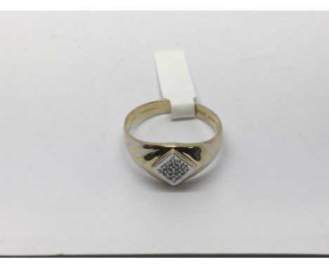 A gold signet style ring with pave set diamonds, approx 2.4g and approx size U.