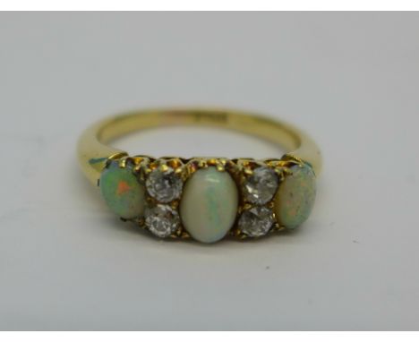 An 18ct gold, opal and diamond ring, 4.3g, O