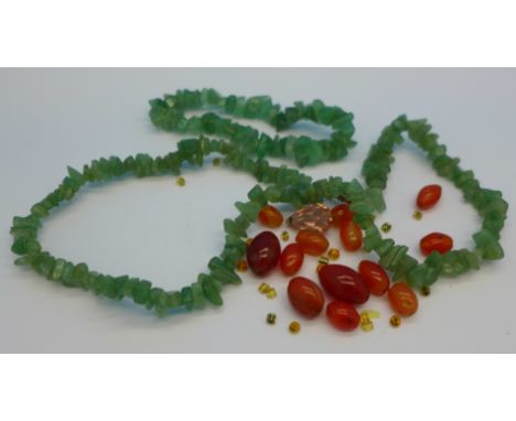 A jade necklace, a bracelet and loose beads