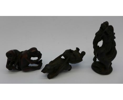A carved netsuke and two other figures