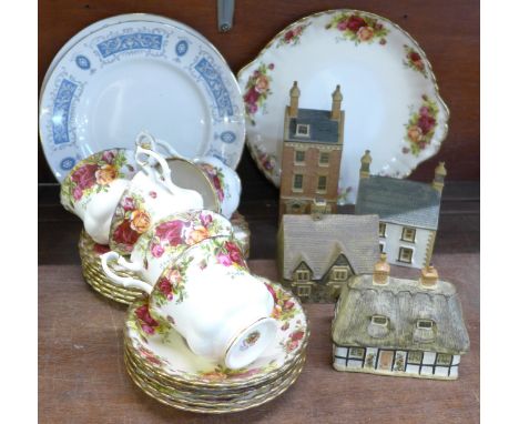 Five Royal Albert Old Country Roses cups, saucers, tea plates and cake plate, four Denby stoneware models of houses and two R