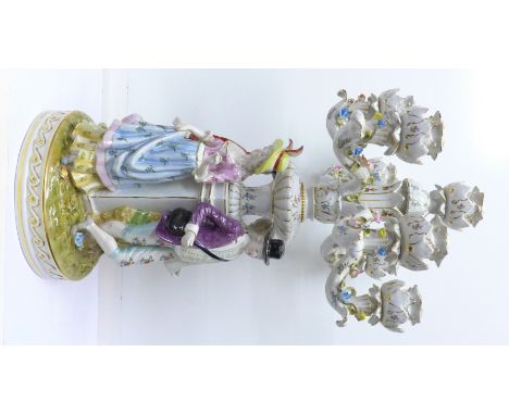 A continental figural and floral encrusted candelabra centrepiece, a/f, 58cm